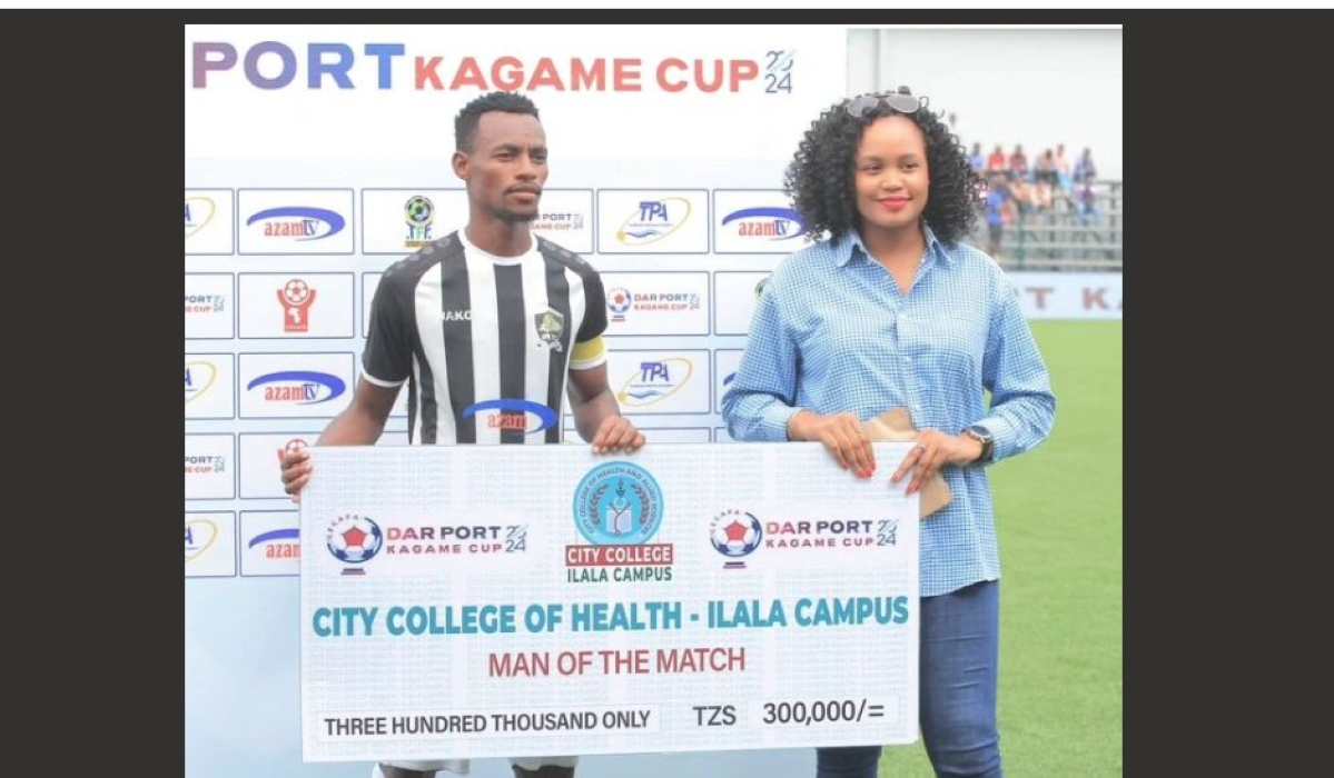 APR captain Claude Niyomugabo gets a cheque during CECAFA Kagame cup.