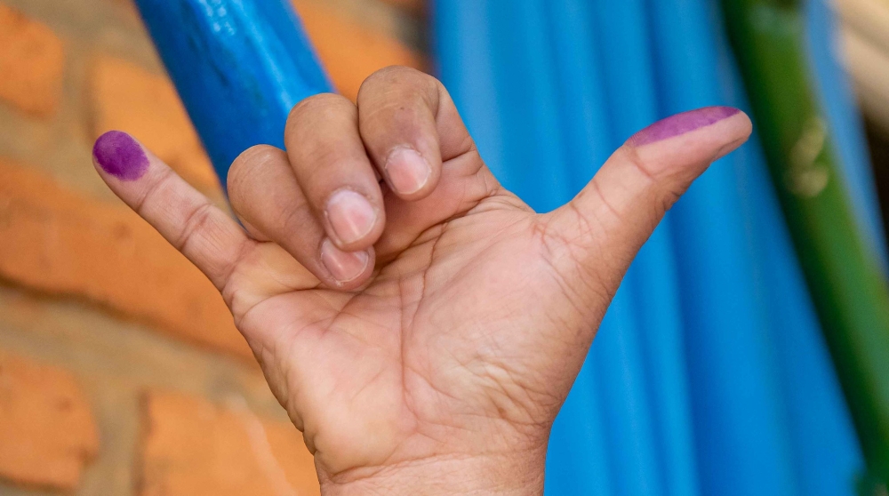 A voter after castiing his vote during the presidential and parliamentary on Monday, July 15. Photo by Dan Gatsinzi