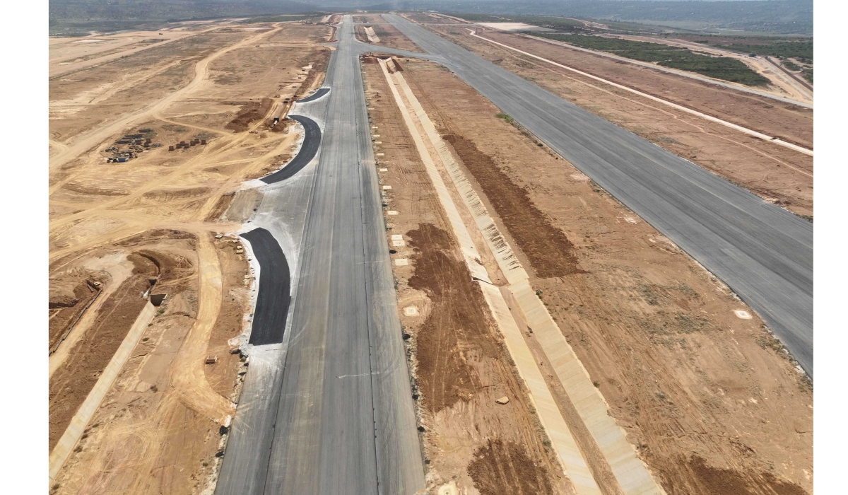 Runway and taxiway with drainage channel at the new airport under construction in Bugesera District. Once completed, the airport will have a 130,000-square-meter main terminal structure capable of handling 8 million passengers per year, and this is expected to increase to more than 14 million in the future. Photos: Courtesy.