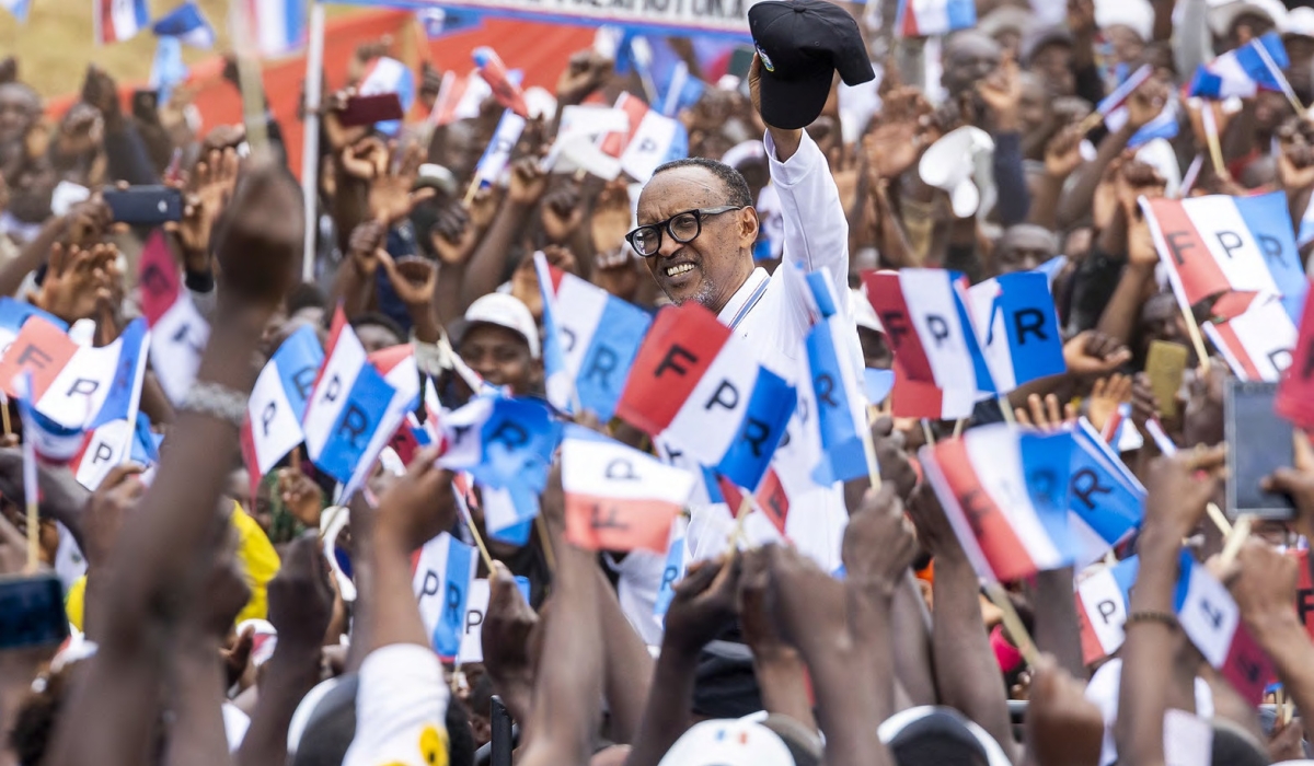 RPF Inkotanyi flag bearer President Paul Kagame greets thousands of supporters during the campaign in Musanze District on June 22. Photo: Olivier Mugwiza