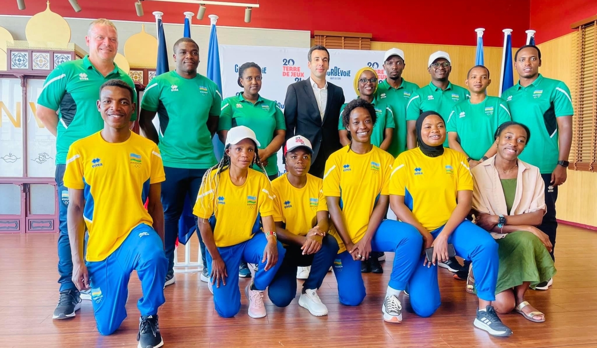 Courbevoie deputy mayor Khalid Ait Omar (fourth left, back row) poses for a picture with Rwanda&#039;s Olympics team.