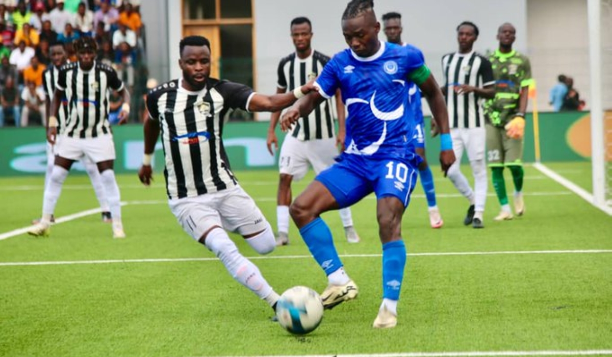 APR&#039;s Mugisha vies for the ball with an Al Hilal player during the match.