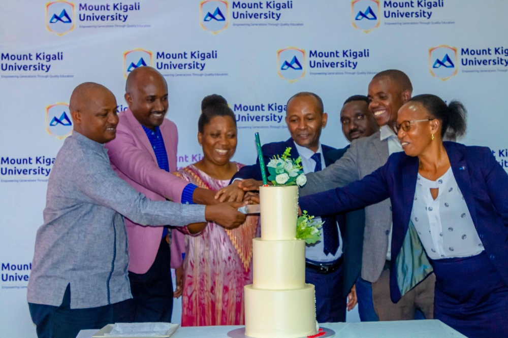 Mount Kigali University staff and alumni during a cake-cutting session to launch the association.