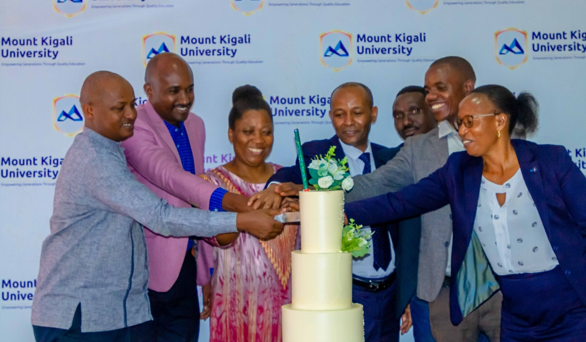 Mount Kigali University staff and alumni during a cake-cutting session to launch the association.