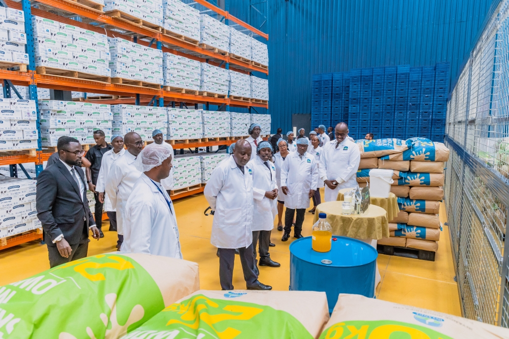 PM Ngirente and officials tour the new plant that will produce 41 tonnes of milk powder, 25.6 tonnes of butter, and 11.3 tonnes of ghee per day. courtesy