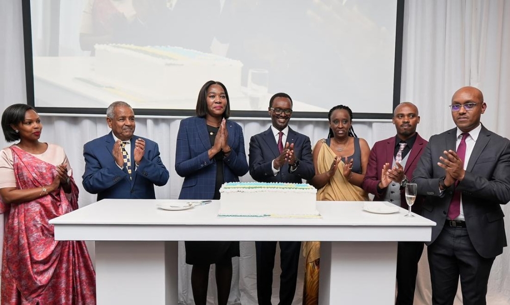 Ambassador Emmanuel Hategeka (C) and South Africa’s Deputy Minister for International Relations and Cooperation, Anna Thandi Moraka and other delegates after cutting a  cake to celebrate the Liberation Day on July 26. Courtesy