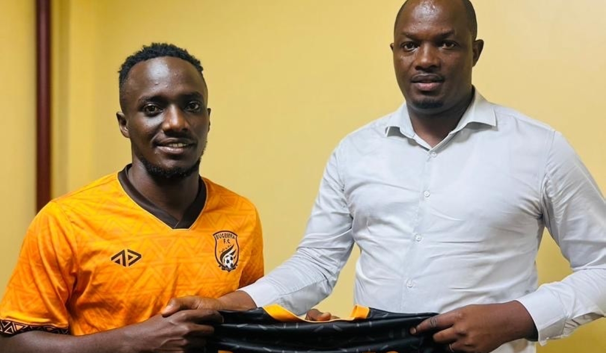 Yannick Bizimana (Left) poses for a picture during the signing ceremony.