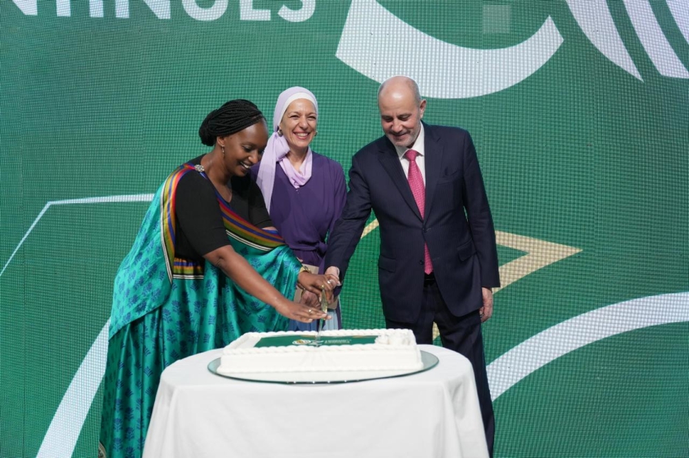 Ambassador Urujeni Bakuramutsa, Princess Basma bint Talal, and Yousef Al - Shamali, Minister of Industry, Trade and Supply cut a cake during the celebration.