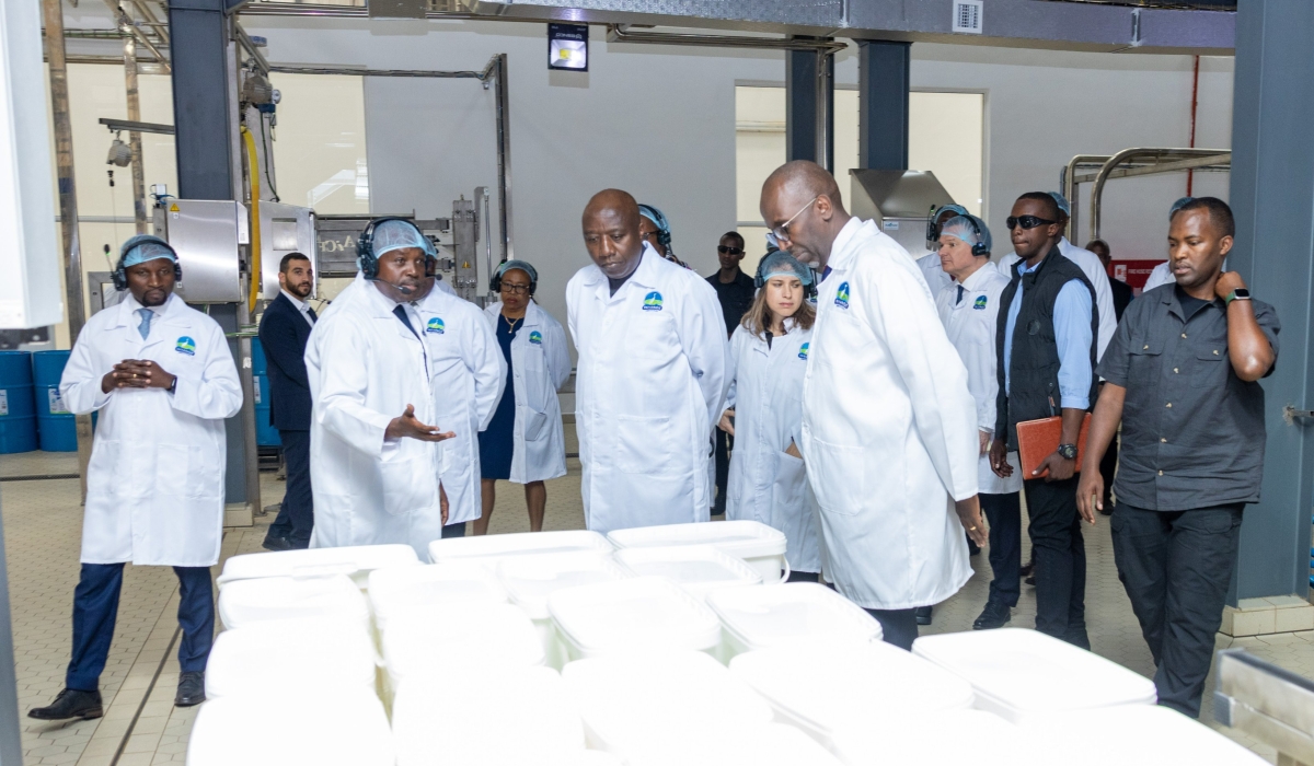 James Kagaba, the Managing Director of Inyange Milk Powder Plant, gives Prime Minister Edouard Ngirente insights into operations at the plant as Ildephonse Musafiri, the Minister of Agriculture and Animal Resources (left) and Jean-Claude Karayenzi, the Executive Chairman of Crystal Ventures Ltd (Right), look on during a guided tour of Rwanda’s first milk powder factory in Nyagatare District, on Wednesday, July 24. Courtesy