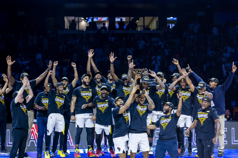 Petro de Luanda players celebrate as they are crowned  BAL 2024 champions at BK Arena in Kigali June 1, 2024. Photo by Olivier Mugwiza.