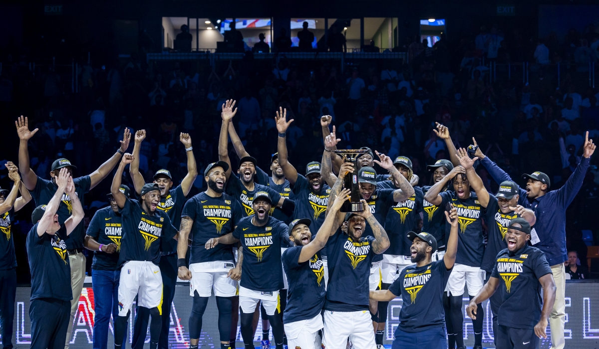 Petro de Luanda players celebrate as they are crowned  BAL 2024 champions at BK Arena in Kigali June 1, 2024. Photo by Olivier Mugwiza.