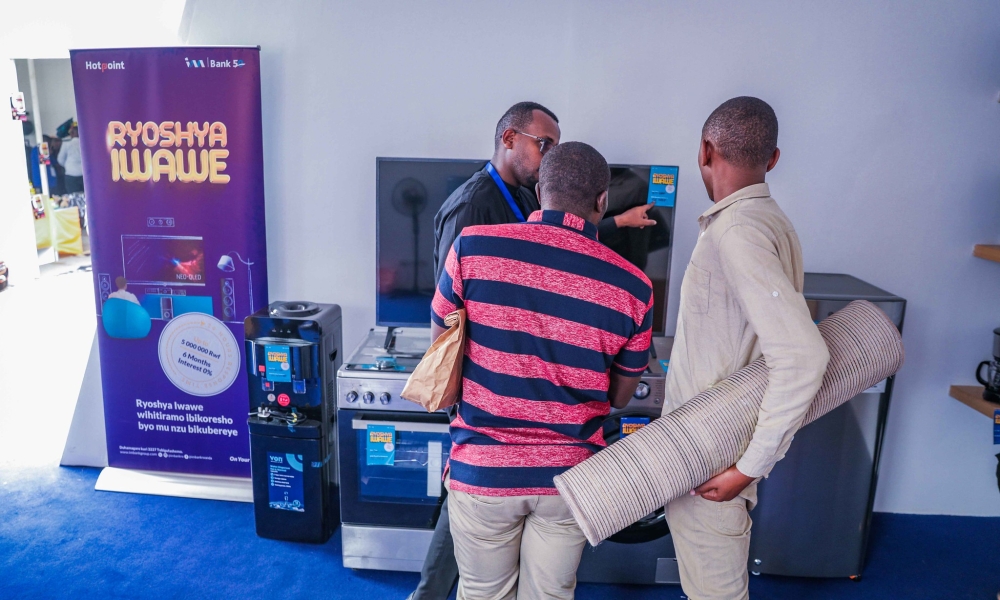 I&M Bank Rwanda clients look some commodities that are showcased  at the Expo 2024, which started on Thursday, July 25, and runs until August 15. Photos by Craish Bahizi.