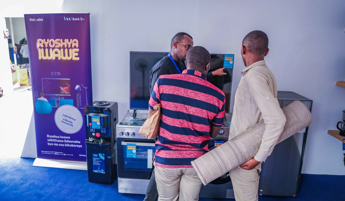 I&M Bank Rwanda clients look some commodities that are showcased  at the Expo 2024, which started on Thursday, July 25, and runs until August 15. Photos by Craish Bahizi.