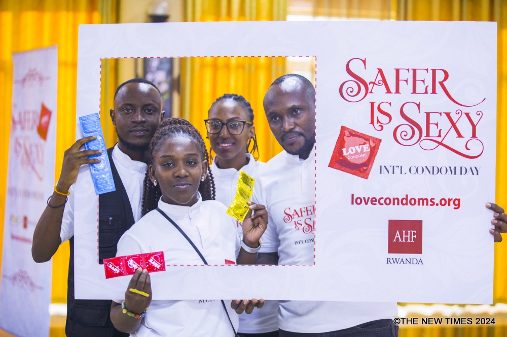 Participants pose for a photo during an awareness campaign on the fight against HIV AIDS in Kigali. Photo by Craish Bahizi