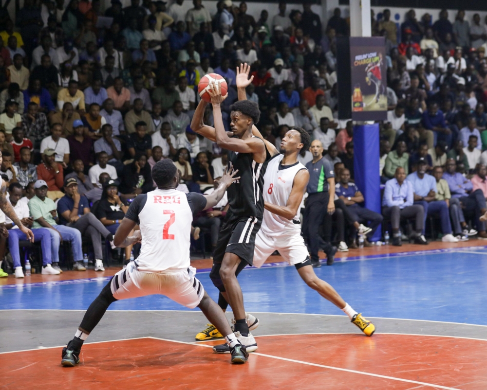 	APR center Osborn Shema (c) tries to shoot during his side&#039;s 77-75 nail-biting win over REG at LDK gymnasium on Wednesday night, July 31- Photo by Dan Gatsinzi