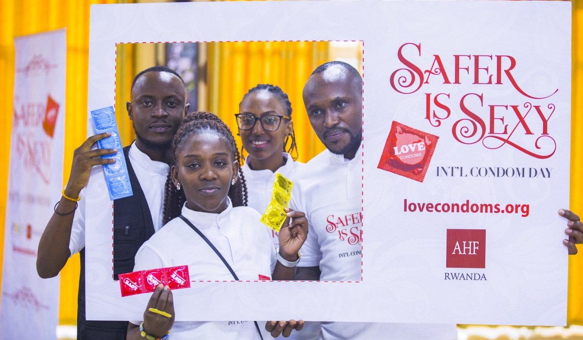 Participants pose for a photo during an awareness campaign on the fight against HIV AIDS in Kigali. Photo by Craish Bahizi