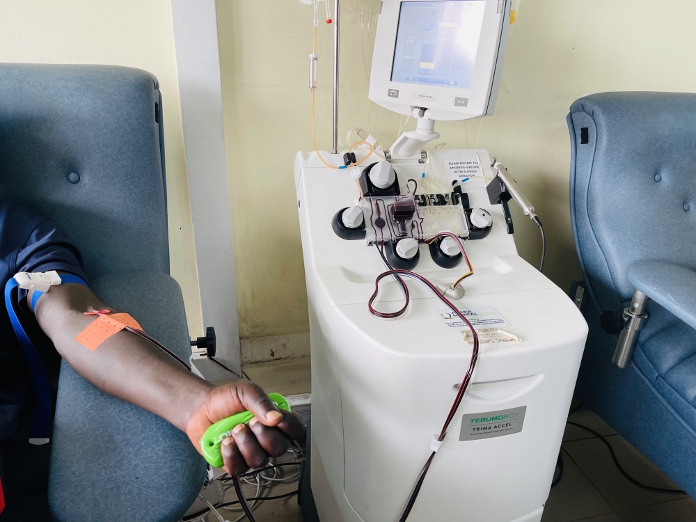 A man donates blood at RBC’s Blood Transfusion Division in Kigali, on July 30, 2024, through apheresis machine which allows a donor to give only the components needed by patients—such as platelets and plasma. The machine separates the components of your blood, retains some, and returns the rest to you.