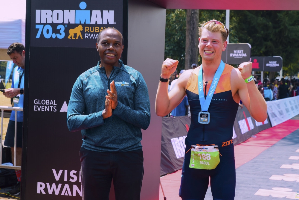 Rwanda Development Board CEO Francis Gatare  awarding the British athlete Raoul Metcalfe, the winner of the third edition of Ironman Rwanda in  Rubavu District on Sunday, August 4. All photos by Olivier Mugwiza