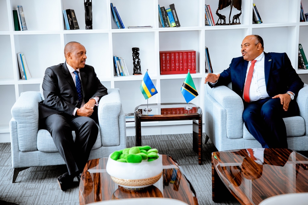 The High Commissioner-Designate of Rwanda to Tanzania, Gen Patrick Nyamvumba, and Amb. Mahmoud Thabit Kombo, the Minister of Foreign Affairs and East African Cooperation of Tanzania, interact shortly after the former presented copies of his letters of credence, on Monday, August 5. Courtesy of  Rwanda High Commission in Tanzania