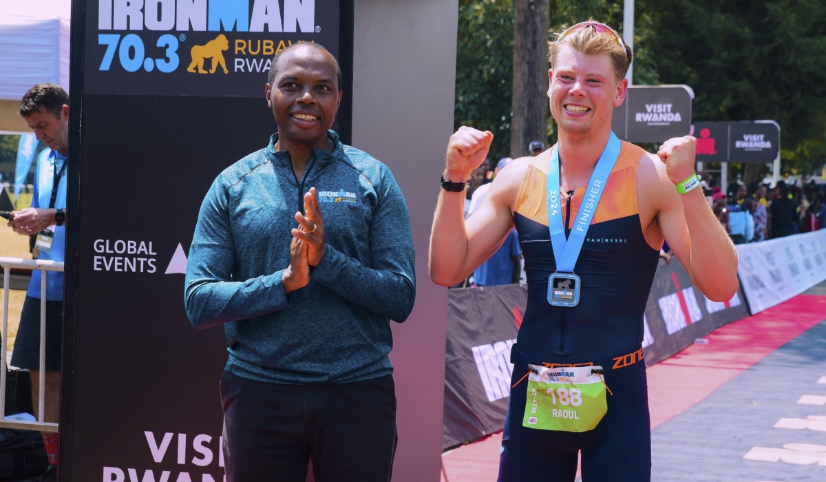 Rwanda Development Board CEO Francis Gatare  awarding the British athlete Raoul Metcalfe, the winner of the third edition of Ironman Rwanda in  Rubavu District on Sunday, August 4. All photos by Olivier Mugwiza