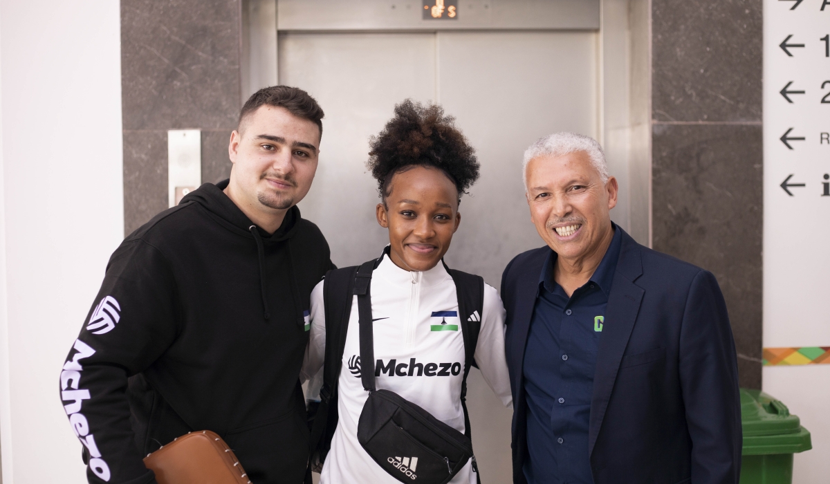 Tau&#039;s coach Hugo Tortosa, Tau and one of Torotsa&#039;s former trainers Moustapha Akkouh pose for a photo.