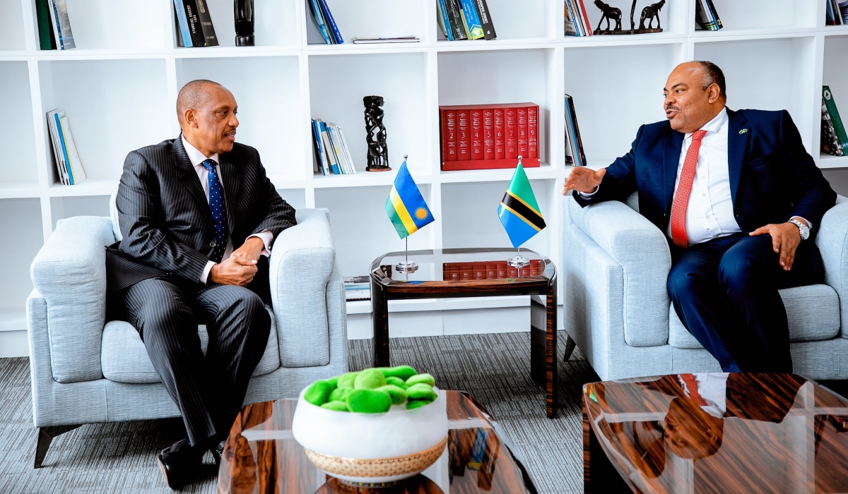 The High Commissioner-Designate of Rwanda to Tanzania, Gen Patrick Nyamvumba, and Amb. Mahmoud Thabit Kombo, the Minister of Foreign Affairs and East African Cooperation of Tanzania, interact shortly after the former presented copies of his letters of credence, on Monday, August 5. Courtesy of  Rwanda High Commission in Tanzania