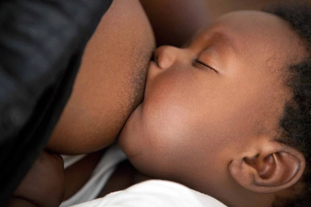 A woman breastfeeding her baby. The new changes aimed to ensure that a newborn child receives adequate care and that the mother has sufficient time to recover and regain strength. File