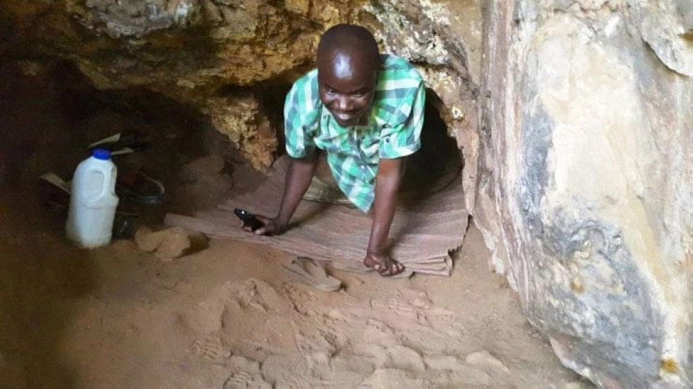 A believer praying from a cave. At least 100 &#039;church caves&#039; have been shut down in the ongoing crackdown, according to Rwanda Governance Board.