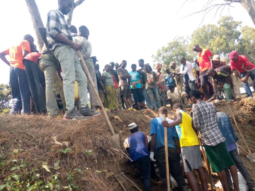 Residents searching bodies of the victims of the 1994 Genocide against the Tutsi near IPRC-Karongi, in Bwishyura Sector, Karongi District.