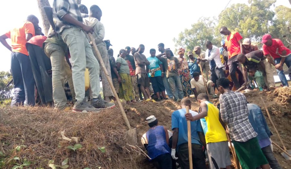 Residents searching bodies of the victims of the 1994 Genocide against the Tutsi near IPRC-Karongi, in Bwishyura Sector, Karongi District.