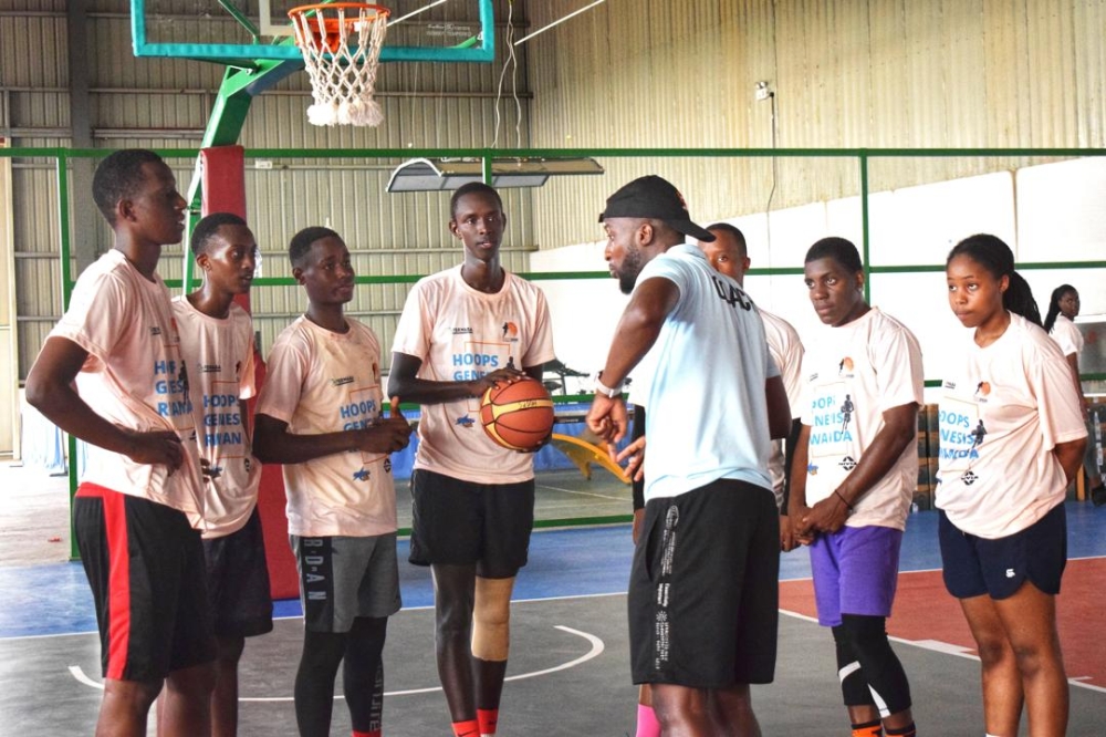 The instructor Innocent Kwizera gives instructions to the youths during a past training camp. The camp will attract youngsters aged 13 to 19 at the Kimironko Basketball Court from 2 pm to 5 pm daily. Courtesy