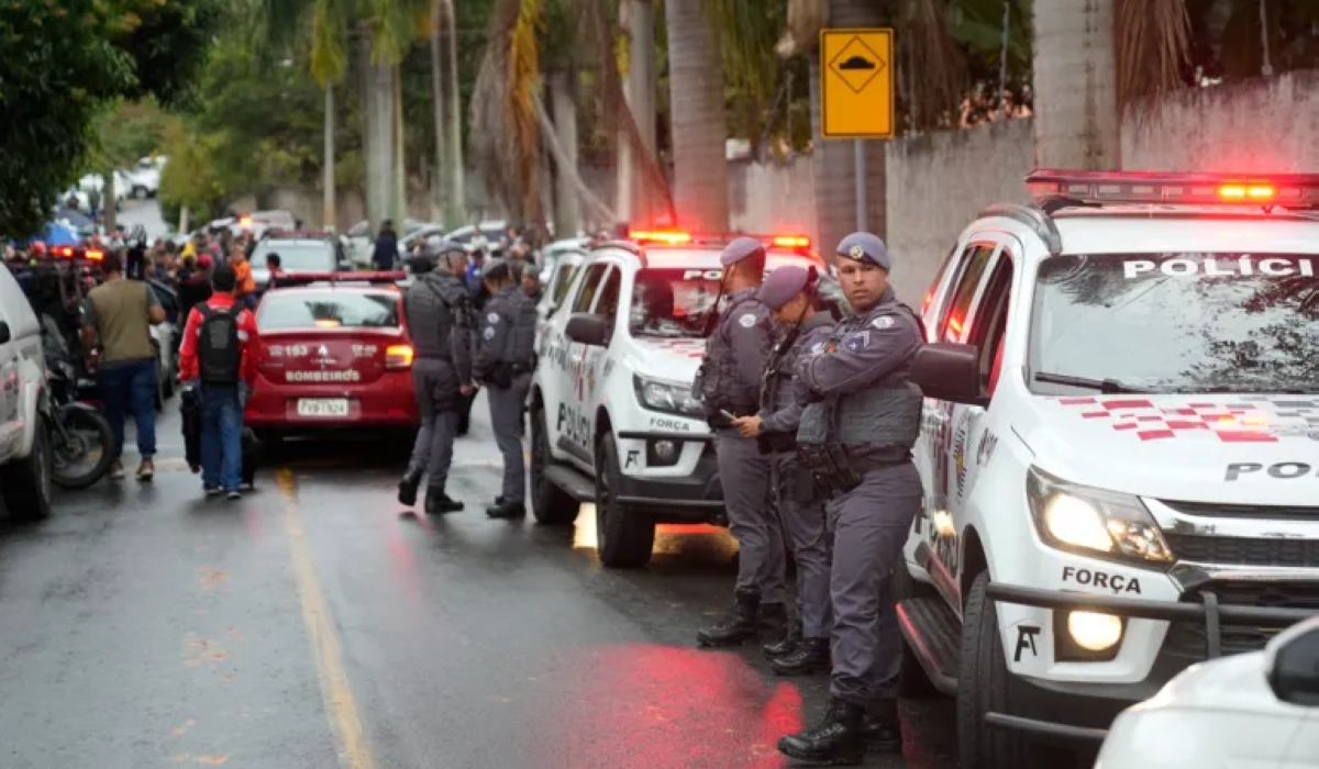 Police stand along the street leading to the gated community where a plane crashed in Sao Paulo state, Brazil, Friday, August 9, 2024. Courtesy