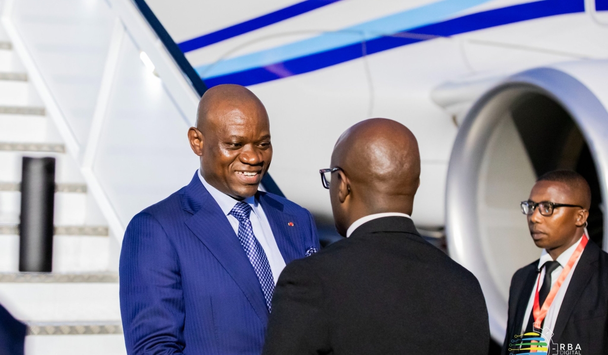 President of Gabon, Brice Oligui Nguema interacts with Minister of Foreign Affairs Olivier Nduhungirehe on his arrival at Kigali International Airport on Saturday, August 10. Photo by Steven Mugenzi