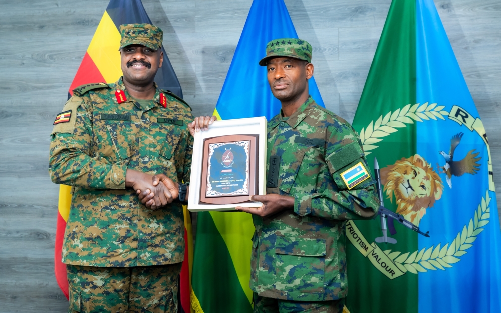 Generals Muganga and Kainerugaba exchanged gifts at the meeting in Kigali on Monday, August 12. Courtesy