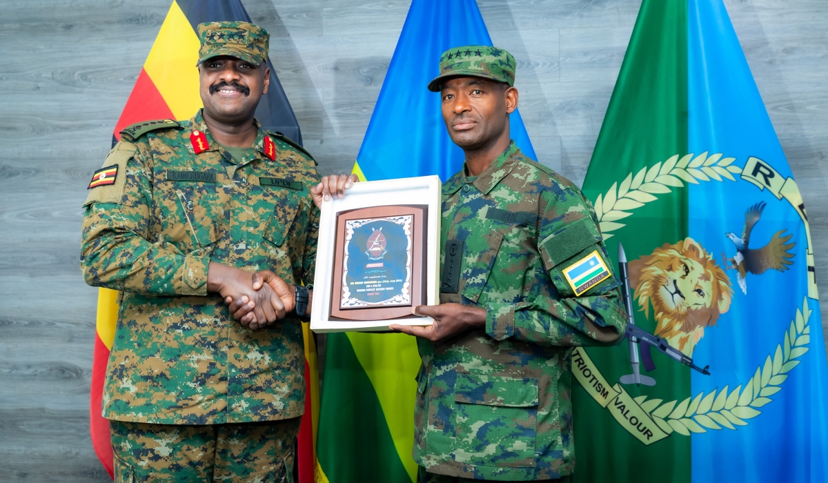 Generals Muganga and Kainerugaba exchanged gifts at the meeting in Kigali on Monday, August 12. Courtesy