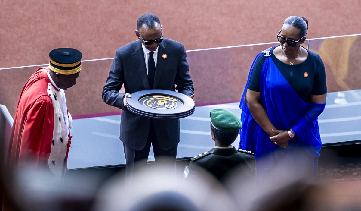 President Paul Kagame receives the national symbols during the inauguration ceremony at Amahoro Stadium on Sunday, August 11. Photo by Olivier Mugwiza