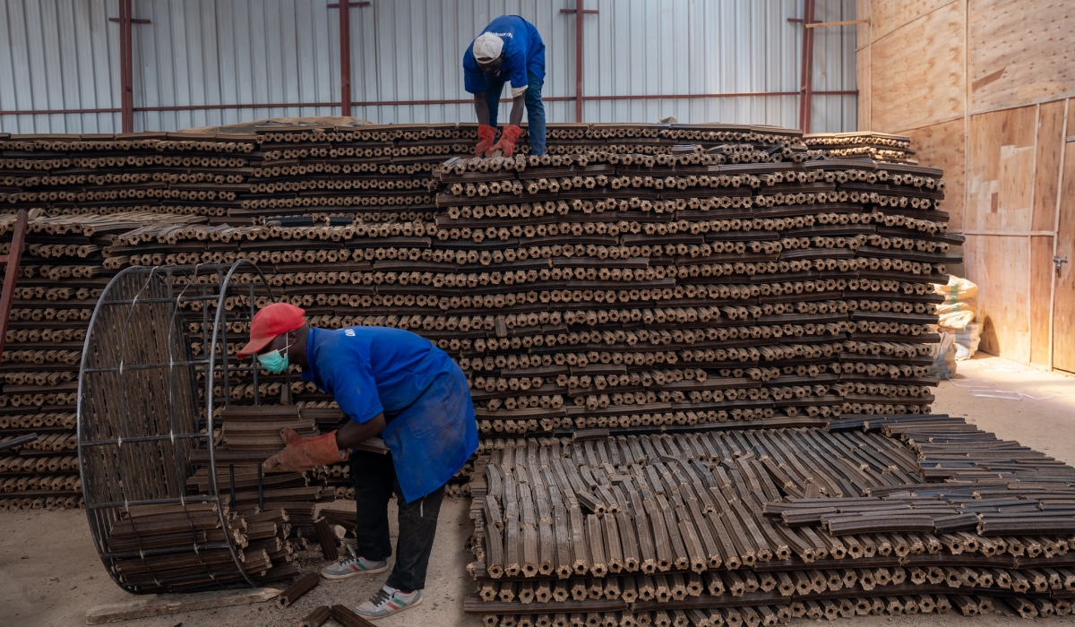 Workers sort brigquettes at OAK Investments that are used in clean cooking. Briquette are used to reduce the number of households that depend on firewood and charcoal for cooking.Courtesy