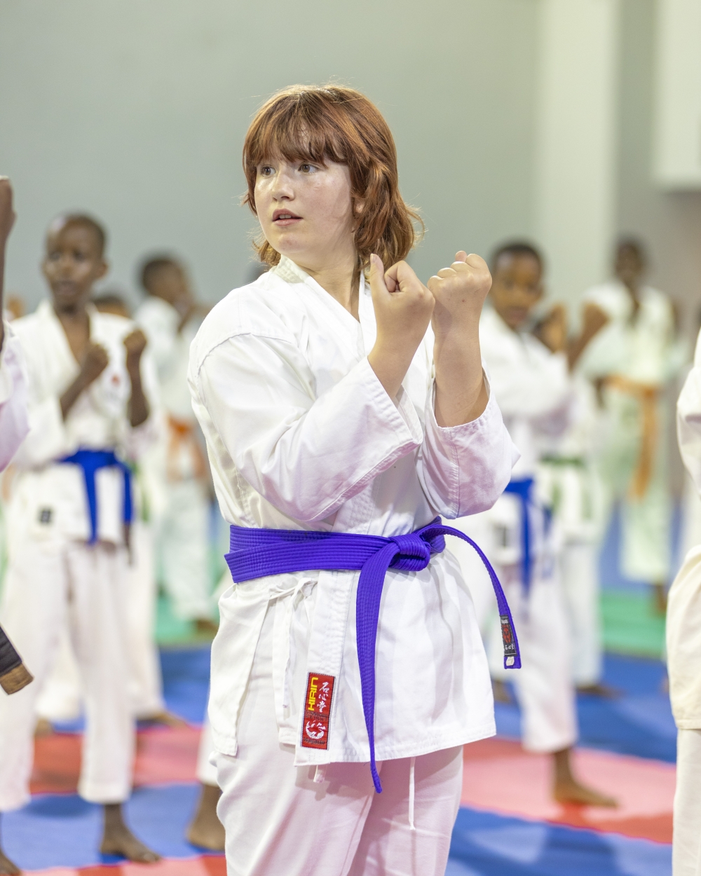 Youngster Emily Jayne Crispin from London&#039;s Do Mu Kyoku Dojo follows proceedings at the start of the fifth Japan Karate Association-Rwanda international Karate technical seminar in Kigali on Wednesday, August 14.