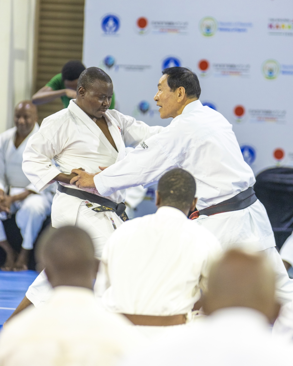 Masaru Kamino (8th Dan), a senior Japanese Karate instructor, teaches punching techniques at the start of the fifth Japan Karate Association-Rwanda international Karate technical seminar in Kigali on Wednesday, August 14. Courtesy