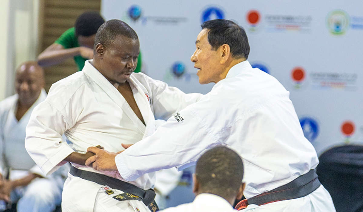 Masaru Kamino (8th Dan), a senior Japanese Karate instructor, teaches punching techniques at the start of the fifth Japan Karate Association-Rwanda international Karate technical seminar in Kigali on Wednesday, August 14. Courtesy