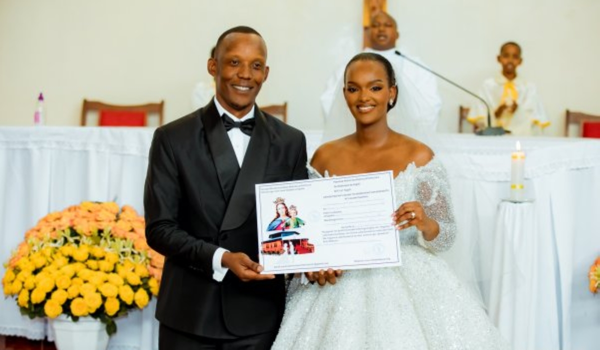 Aurore Kayibanda and businessman Jacques Gatera pose during their wedding ceremony at Marie Auxiliatrice Church on Thursday, August 15. PHOTOS BY IGIHE