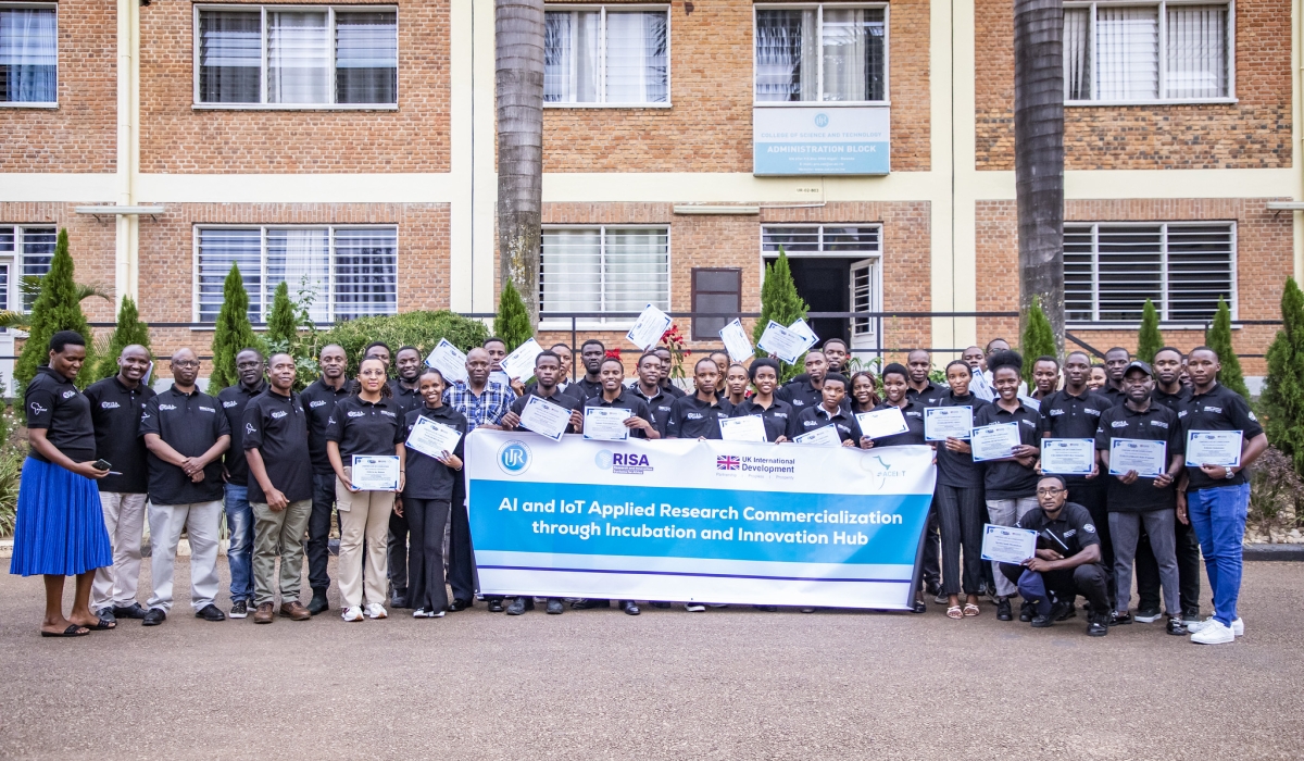 Trainees and officials pose for a group photo after concluting the workshop. Emmanuel Dushimimana