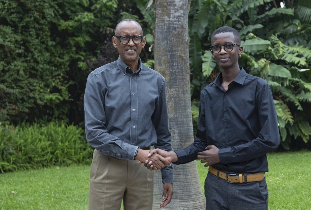 President Paul Kagame congratulates Denys Prince Tuyisenge who won a gold medal in the Pan African Mathematics Olympiad, at Village Urugwiro on Thursday, August 22. Photos by Village Urugwiro