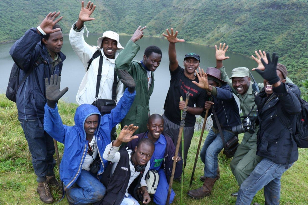 Some visitors pose for a group photo at Bisoke