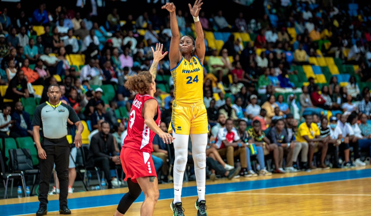 American-born powerforward Keisha Hampton takes a three pointer during Rwanda&#039;s 80-62 victory over Lebanon in a Group D game on Monday, August 20 at BK Arena- Photo by Dan Gatsinzi