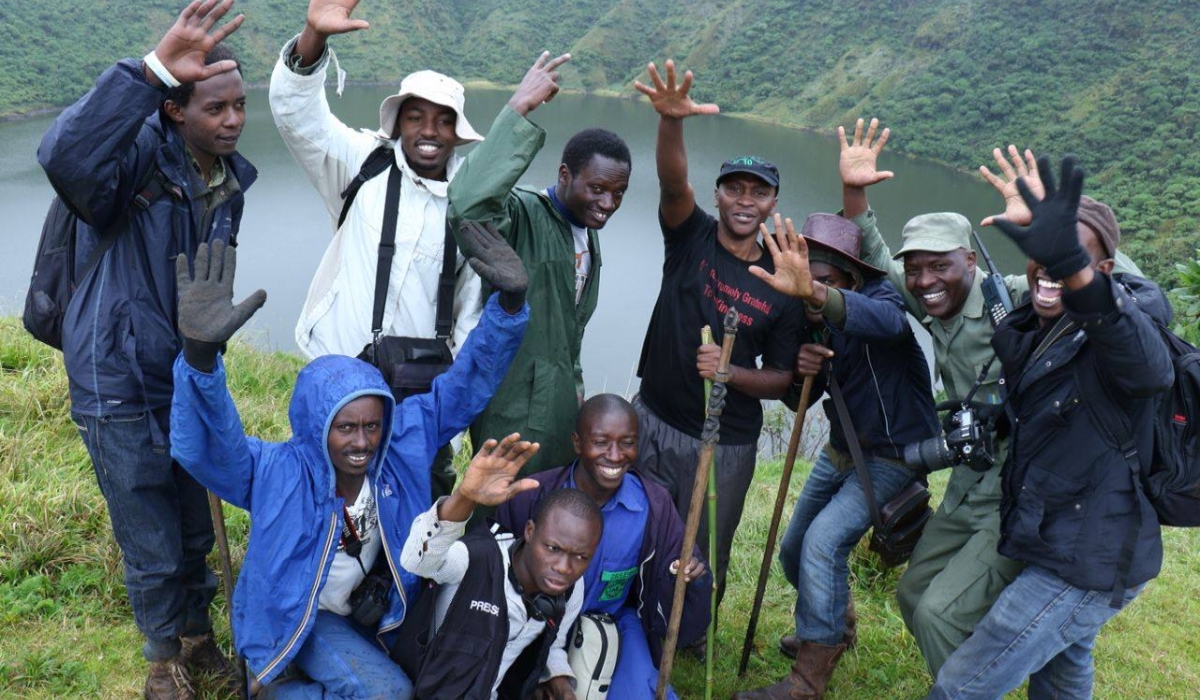 Some visitors pose for a group photo at Bisoke