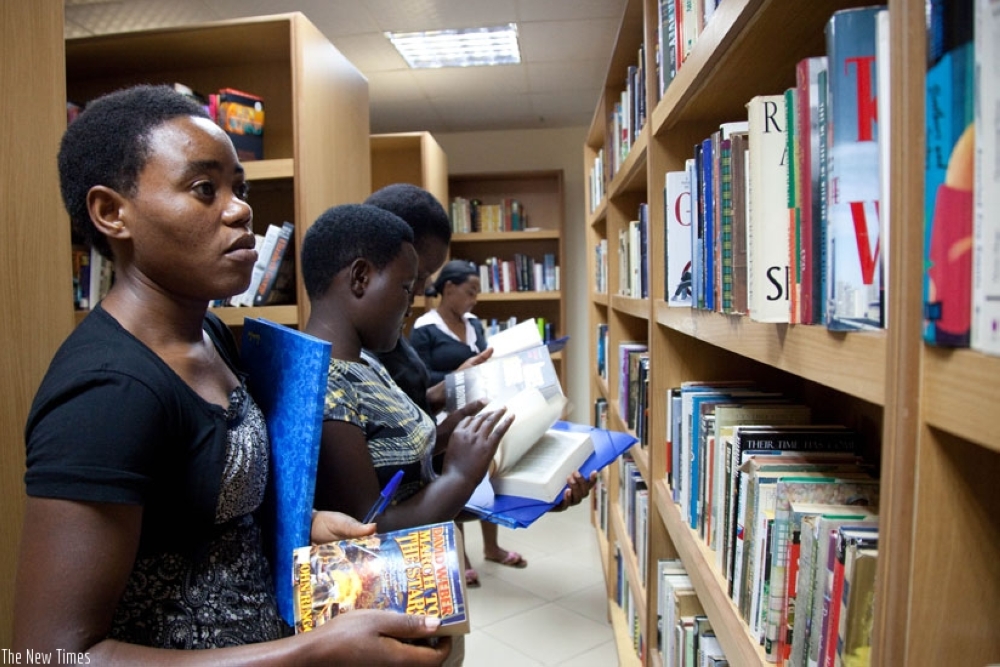 Students search for books to read at Kigali Public Library