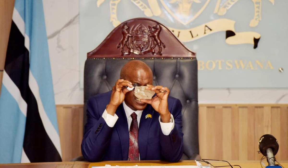 Botswanan President Mokgweetsi Masisi inspects the 2,492-carat diamond discovered in the Karowe Diamond Mine in north-central Botswana, in Gaborone, Botswana, on Aug. 22, 2024. (Photo by Tshekiso Tebalo/Xinhua)