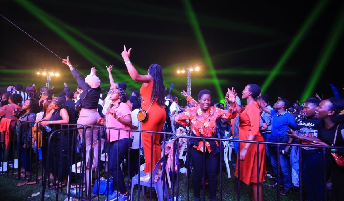 Thousands of revelers sing with Rwandan Gospel artiste Israel Mbonyi during his maiden concert on Friday night, August 23, at Lugogo Cricket Oval, Kampala in Uganda. Photos by Igihe