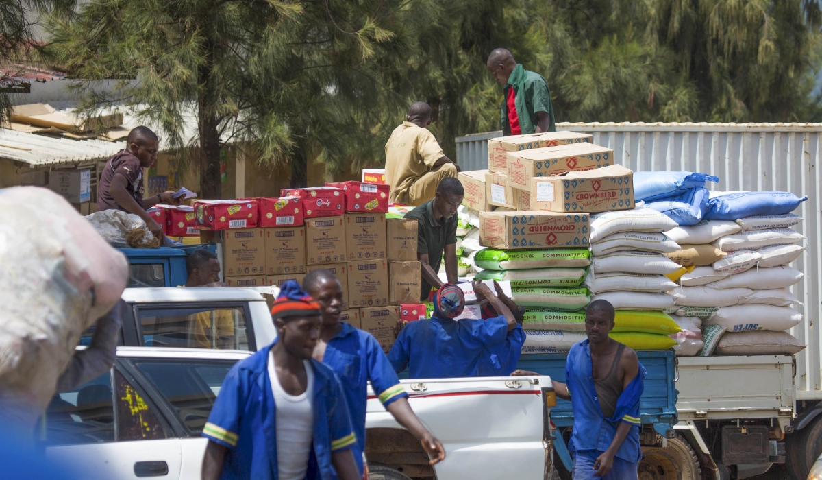 Workers load goods to be transported to the upcountry commercial centres. File